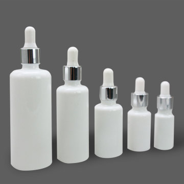 white glass cosmetic bottle with bamboo dropper