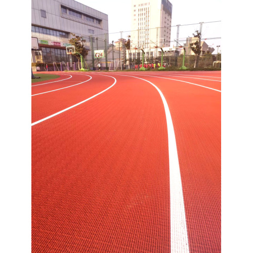 Pista sintética com textura de grão de milho para estádios