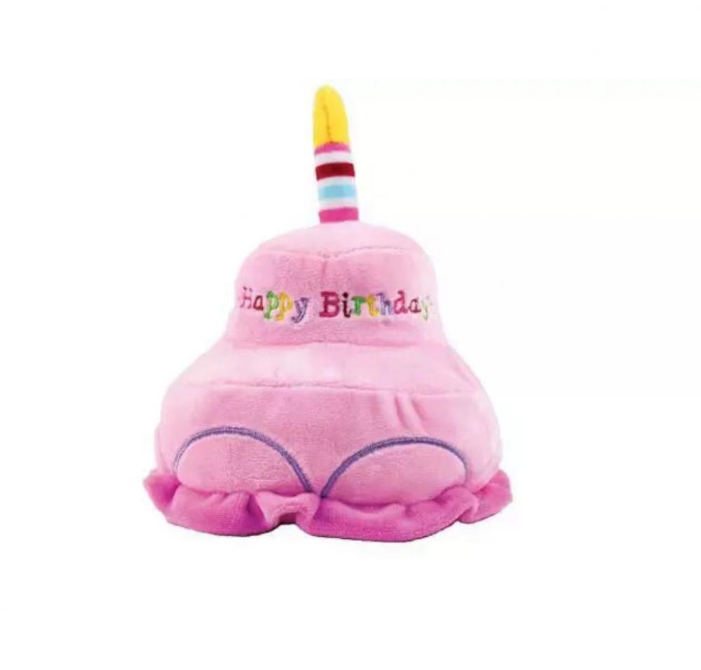 Pink birthday cake with candle stuffed toy