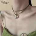 Handcrafted Green Rice Beads with White Lily Pendant