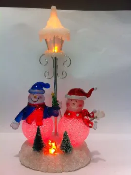 Snowman Christmas gifts under the lights