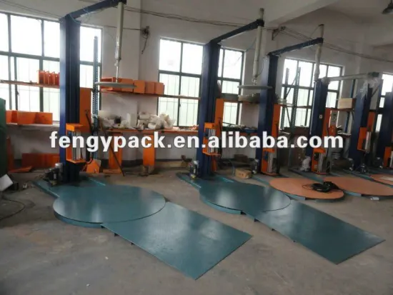 prestretch wrapping machine with top hold