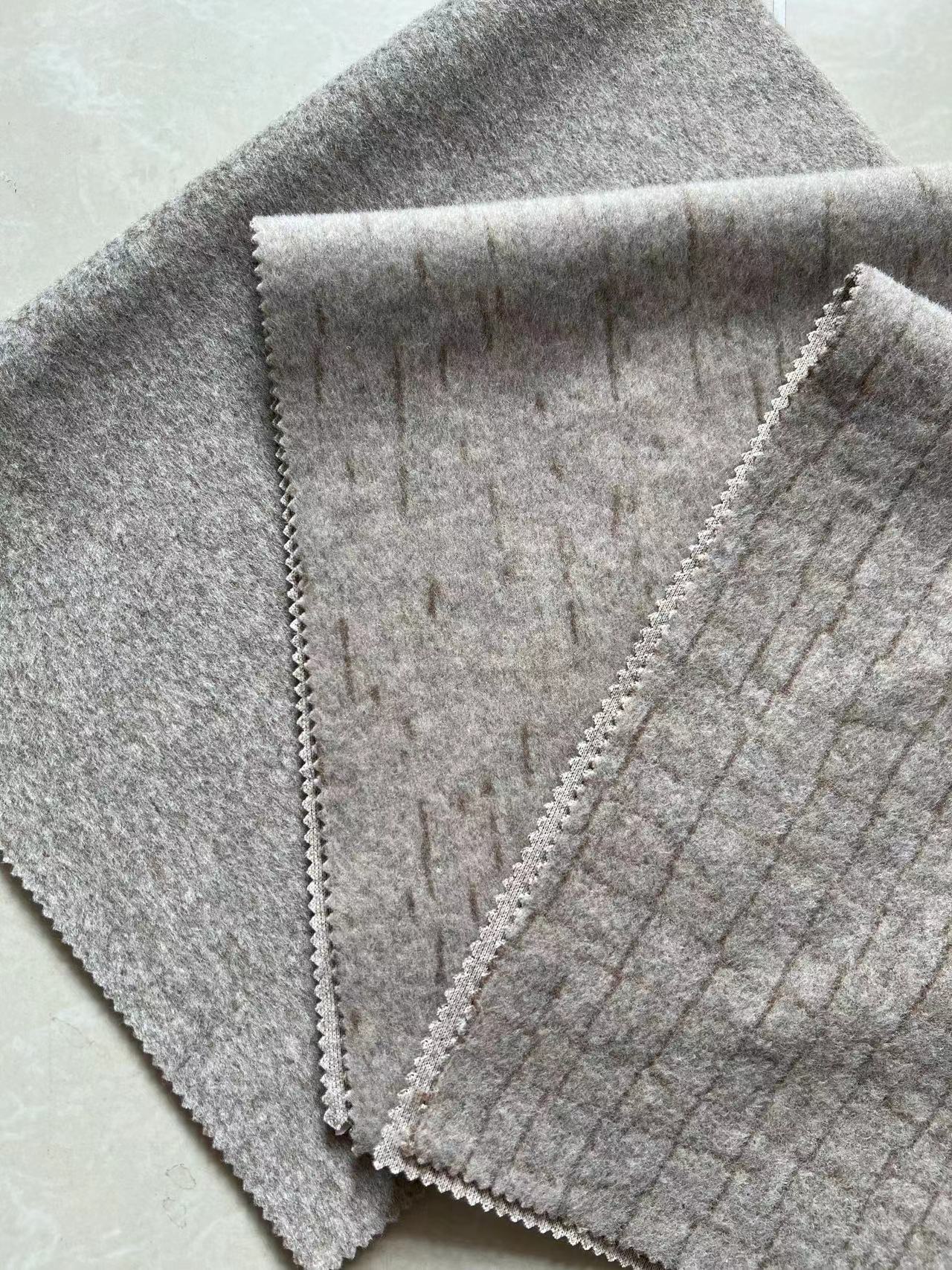 Knitted brushed wool fabrics with solid colours