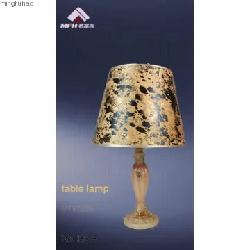 Contemporary fabric hotel beside table lamp