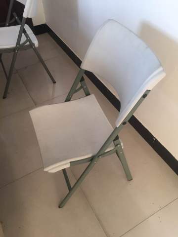 Folding plastic white chairs