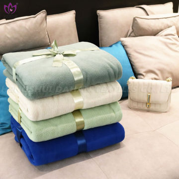 Solid color polar fleece blanket.