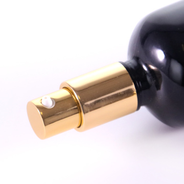 Black glass bottle with golden aluminium caps