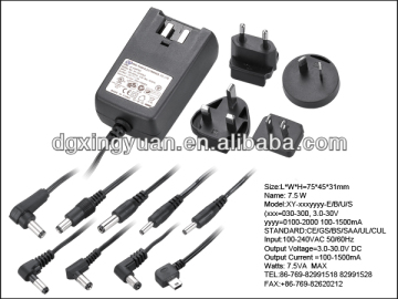 Interchangeable plug universal power adapters