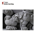 brick carved lion and foo dog