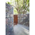 Садовый акцент с дизайном стены Gabion