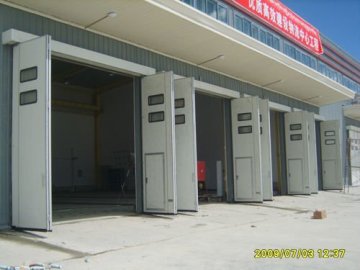 Industrial folding door Made in China with a small door| High quality industrial with windoor