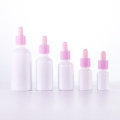 Opal white essential oil bottle with pink dropper