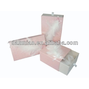 Fancy cardboard handmade drawer boxes with white feathers