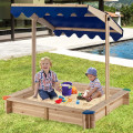幼児用の天蓋の木製の砂場を添えたキッズサンドボックス