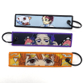 Anpassad designvävd Jet Tag Anime Fabric Keychain