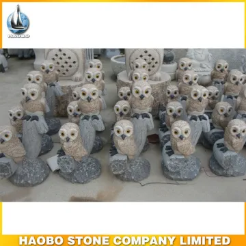 Owl sculpture made of yellow granite