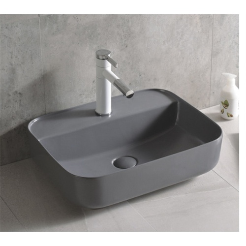 Lavabo rectangular de cerámica negro mate sobre encimera