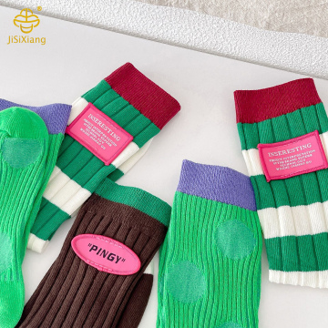 Korean version color blocking manual labeling mid tube socks for women