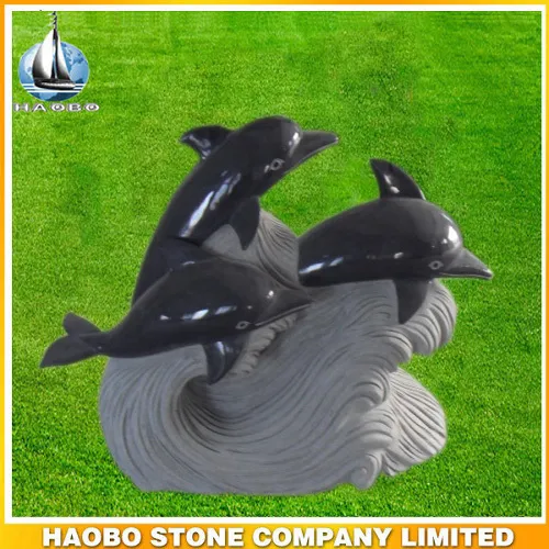 Stone sculpture of sea animal 3 happy dolphins