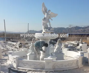 White marble outdoor fountain with lion head sculpture