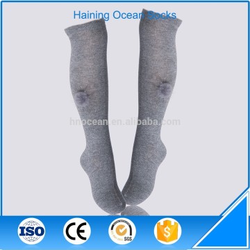 Young girl pompom socks grey over knee high socks