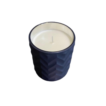 Amber scented candle in glass jar