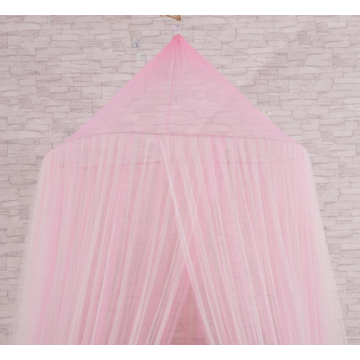 Pink bed canopy hanging from ceiling