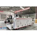 High capacity SPC floor production machine