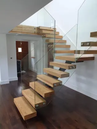 Simple glass railing for modern European stairs