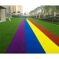 Tapis de pelouse synthétique d'herbe rouge d'herbe artificielle d'arc-en-ciel des etats-unis pour la décoration d'école