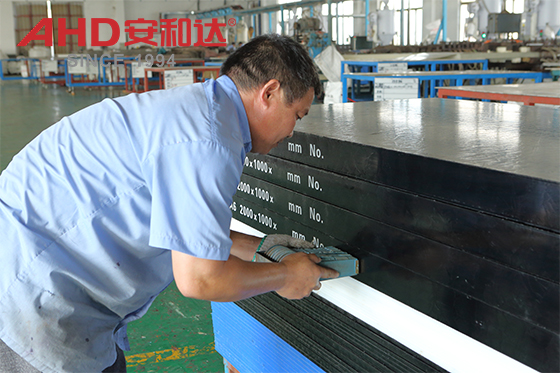 AHD worker and plastic sheet