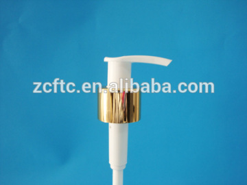 White lotion dispenser pump with golden aluminum smooth closure