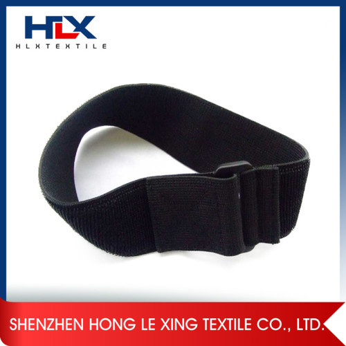 Elastic arm band with hook and loop
