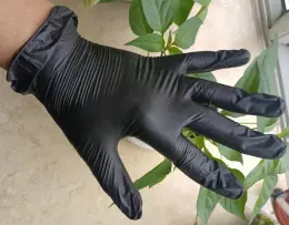 Disposable black vinyl glove