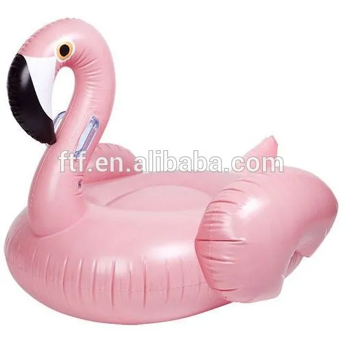 pink inflatable swimming flamingo