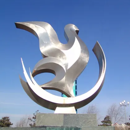 Abstract polished stainless steel pigeon sculpture