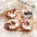 DIY ลูกปัดไม้ธรรมชาติถักสร้อยข้อมือเคี้ยวของเล่น