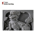 brick carved lion and foo dog