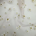 Tessuto per abiti da bambino in poliestere con glitter dorati floreali in schiuma