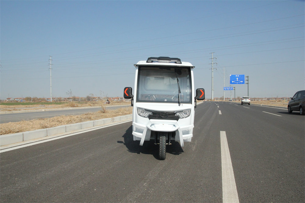 Tricycle with large door and large compartment