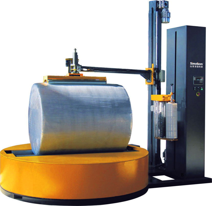 Reel Wrapping Machine With Top Palten Device