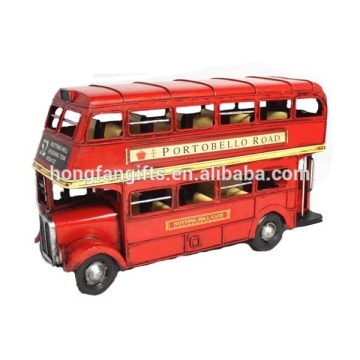 red metal handmade double deck bus
