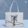 Elegante bolso de hombro de lino con mariposas coloridas para mujer