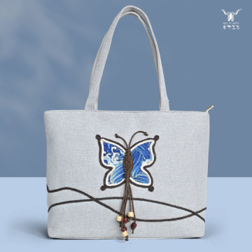 Elegante bolso de hombro de lino con mariposas coloridas para mujer