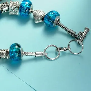 Bracelet, made of pandora beads and brass chain, professional pandora factory