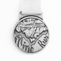 Silver raised round metal running medal