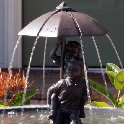 Bronze boy and girl under umbrella fountain boy and girl garden statue