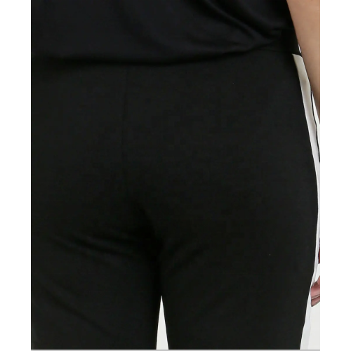 Schwarze und weiße kontrastierende Hose mit seitlichen Einsätzen