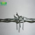 Galvanized barded wire fence