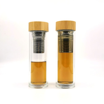 Botellas de agua caliente de vidrio de doble pared al por mayor con infusor de té y cubierta de bambú